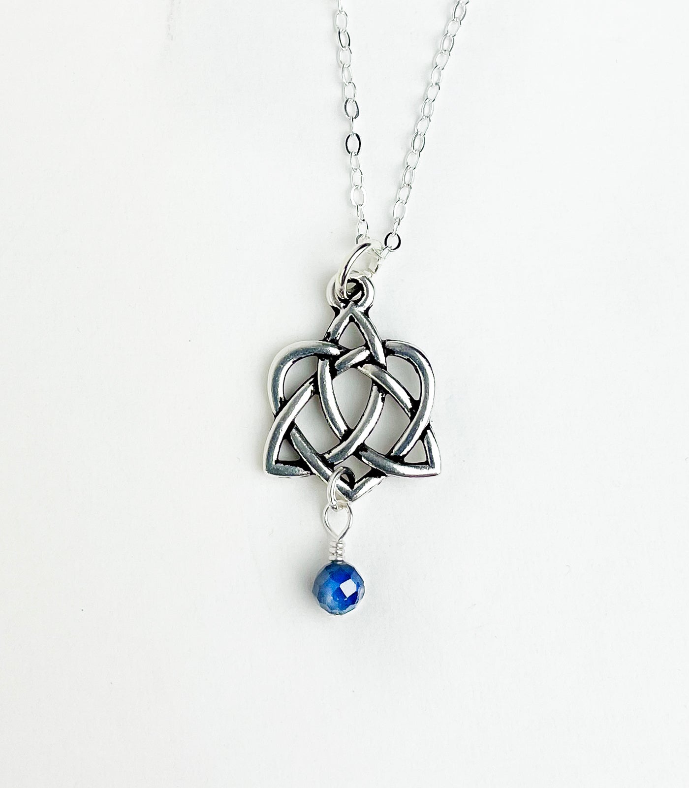 Sapphire with Celtic Trinity knot with Intwined Heart