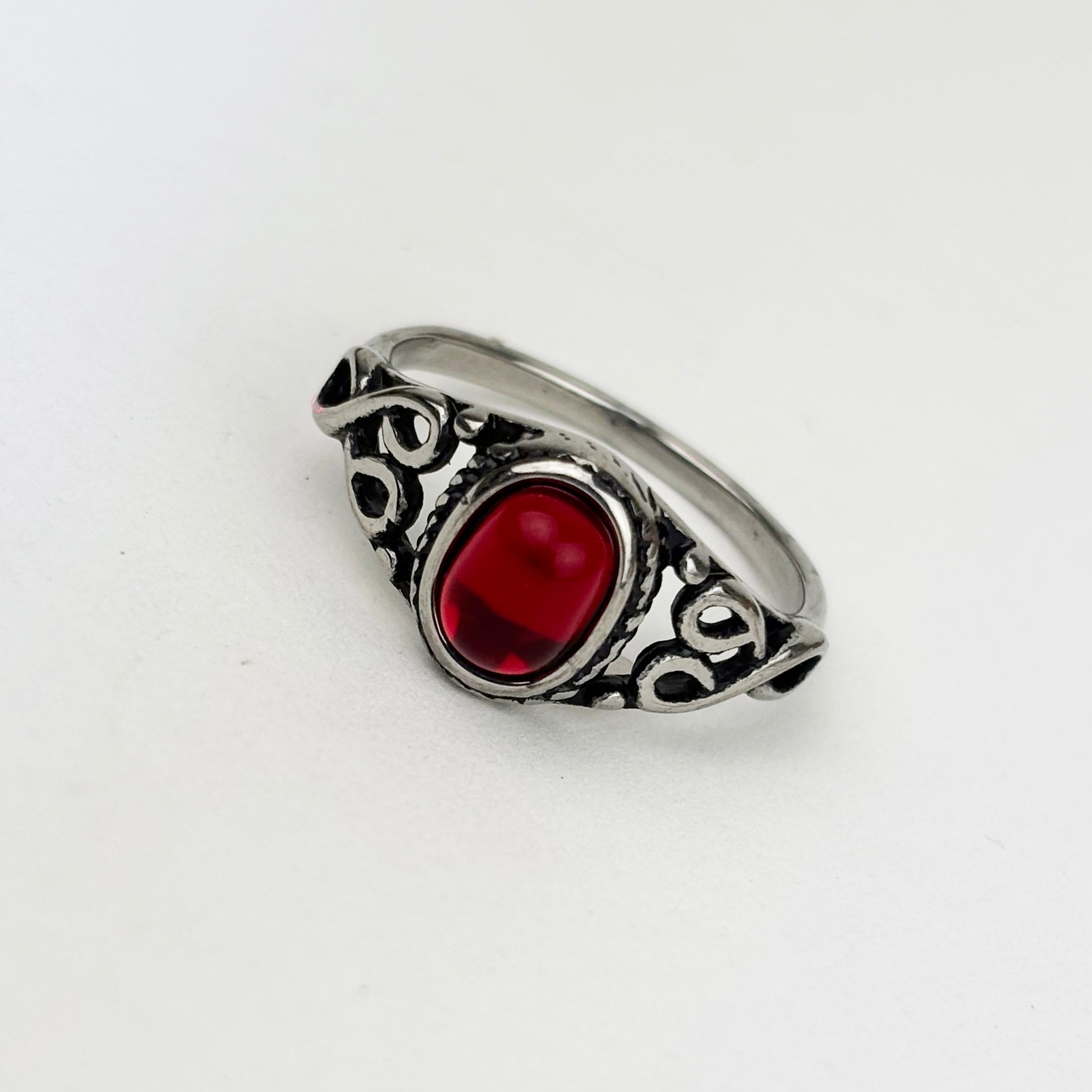 Woman's ring with red oval stone