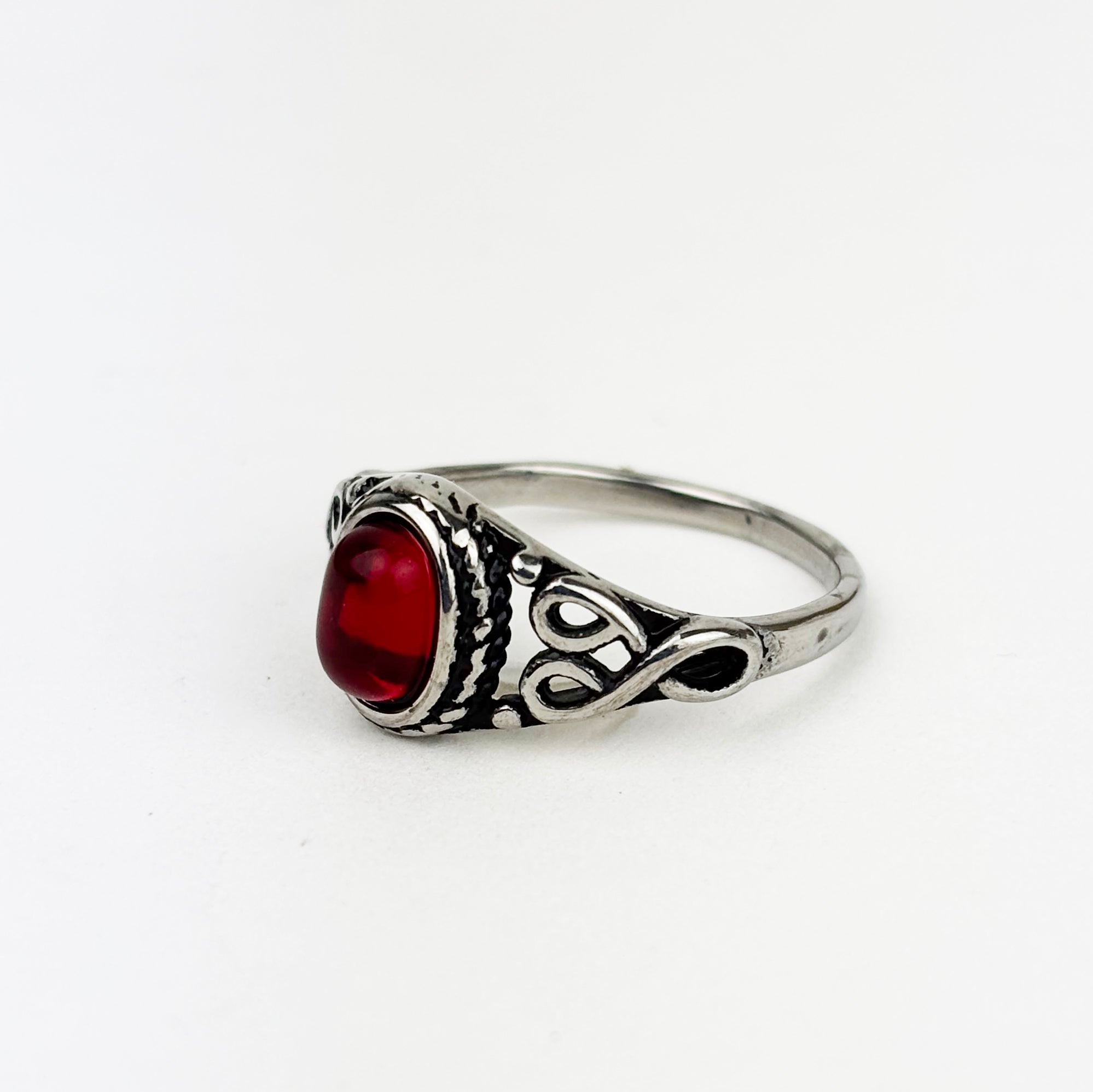 Woman's ring with red oval stone