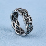 DM-Ring-STO-595  Open Celtic Knot with Faceted Teal Glass Stones Band