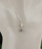 GS669 White Freshwater Pearl with Round Celtic Knot
